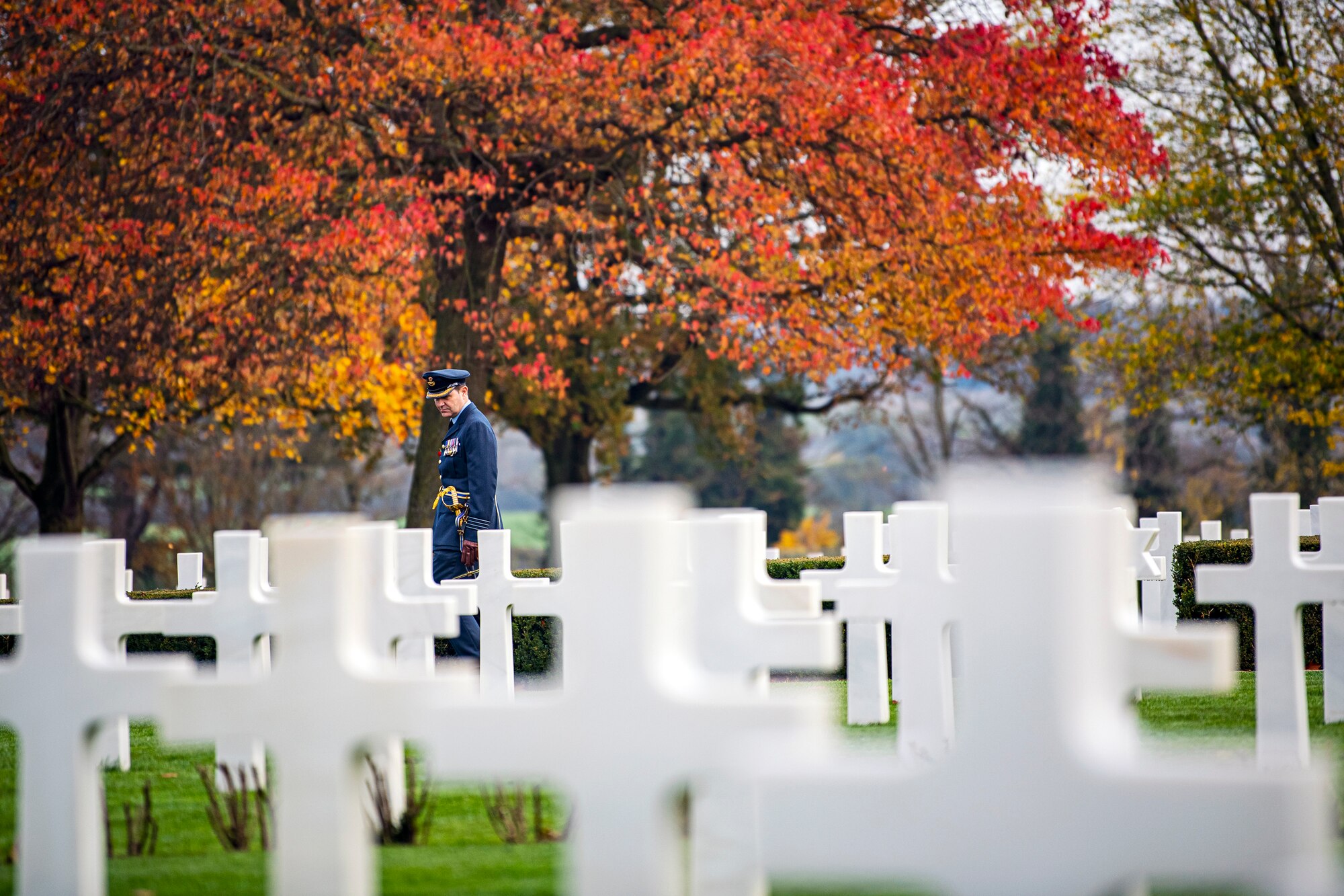 Royal Air Force Group Captain Phil Arnold, RAF High Wycombe commander, observes the headstones at Cambridge American Cemetery and Memorial, England, Nov. 9, 2020. Cambridge American Cemetery is the only World War II American cemetery in England. (U.S Air Force photo by Senior Airman Eugene Oliver)