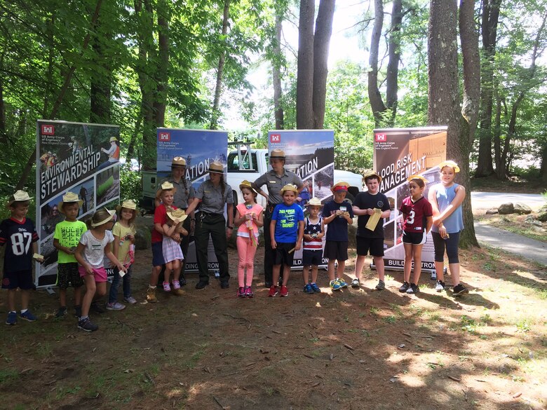 The newest Tully Lake Junior Rangers pose for a picture with their Summer Ranger mentors after the graduation ceremony.