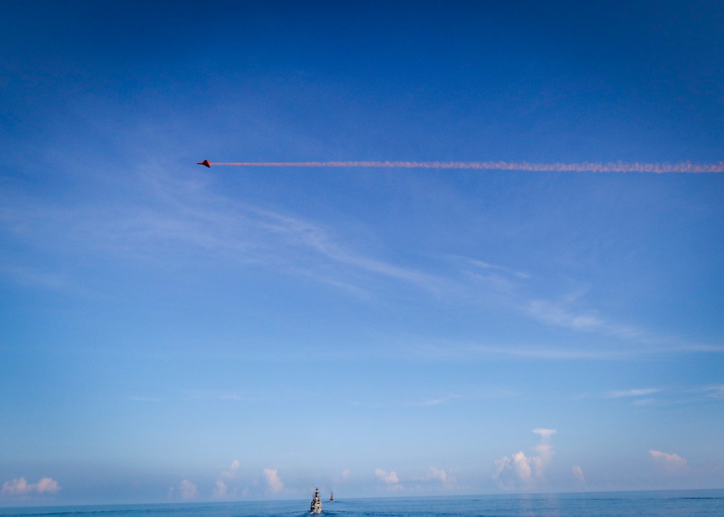 An expendable aerial target flies by the Arleigh Burke-class guided-missile destroyer USS John S. McCain (DDG 56) during a live-fire gunnery exercise with ships from multiple nations as part of Malabar 2020. Malabar is an India-led multinational exercise designed to enhance cooperation between Indian Navy (IN), Royal Australian Navy (RAN), Japan Maritime Self-Defense Force (JMSDF) and U.S. maritime forces. Australian, Indian, Japanese and American maritime forces routinely operate together in the Indo-Pacific, fostering a cooperative approach toward regional security and stability.