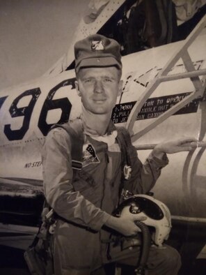 photo of man by a plane
