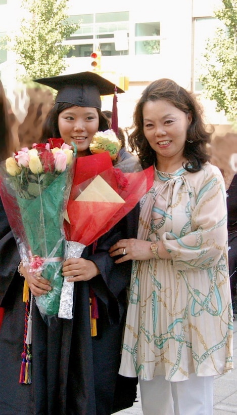 Emily is seen here with her mother at graduation.