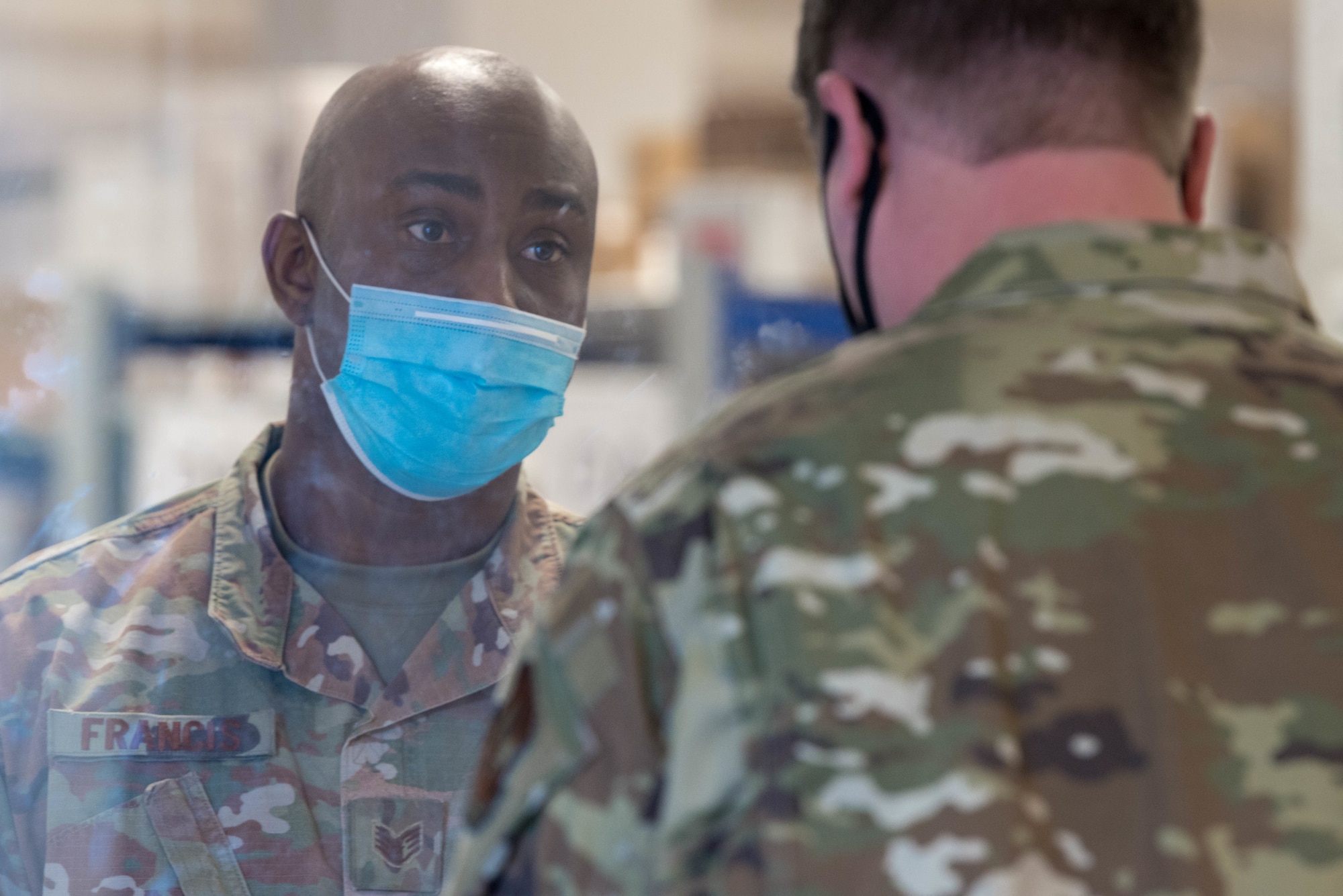 An Airman assists a customer in the Northside Post Office at Ramstein Air Base.