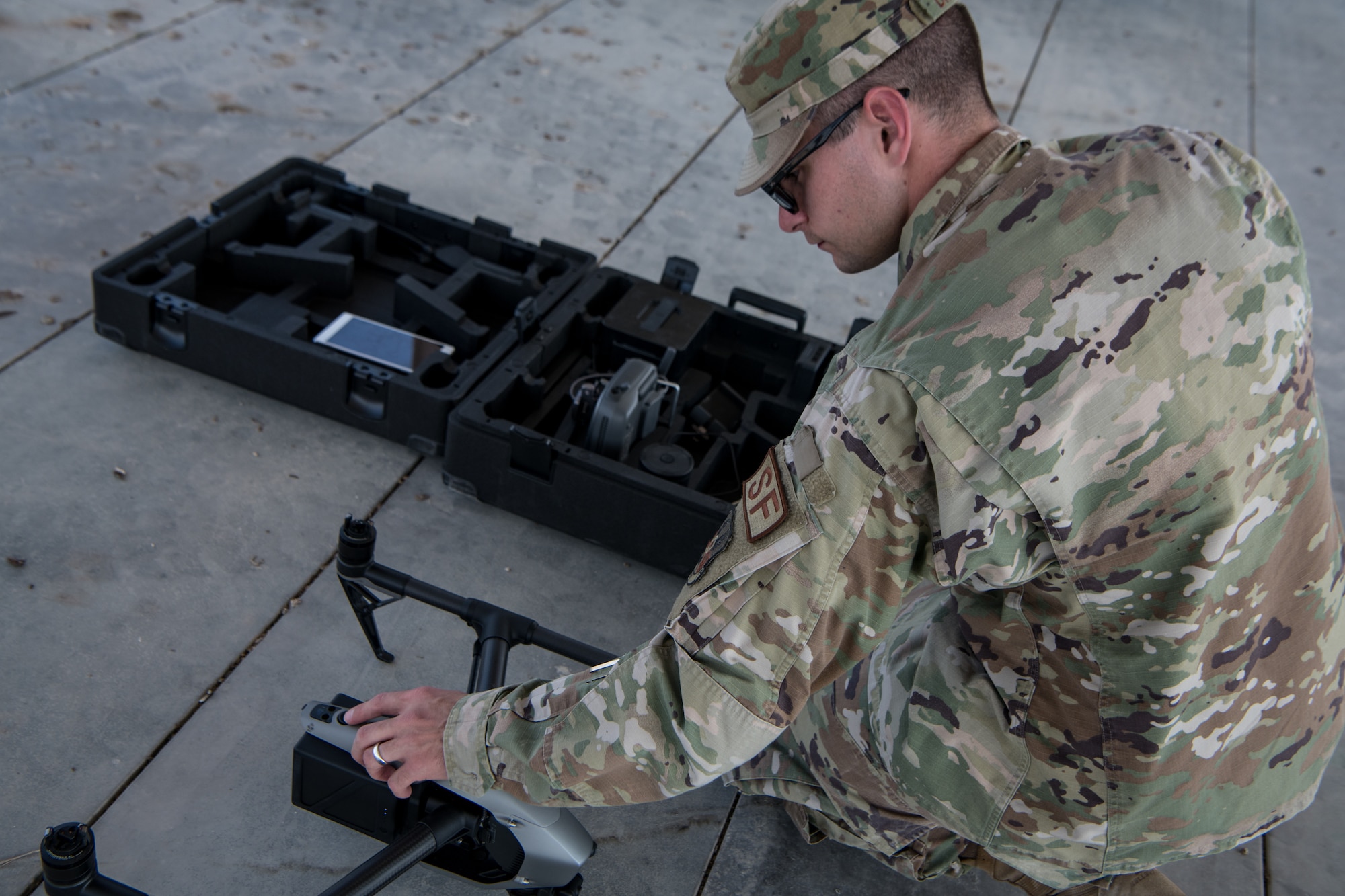 Airman loads drone into case