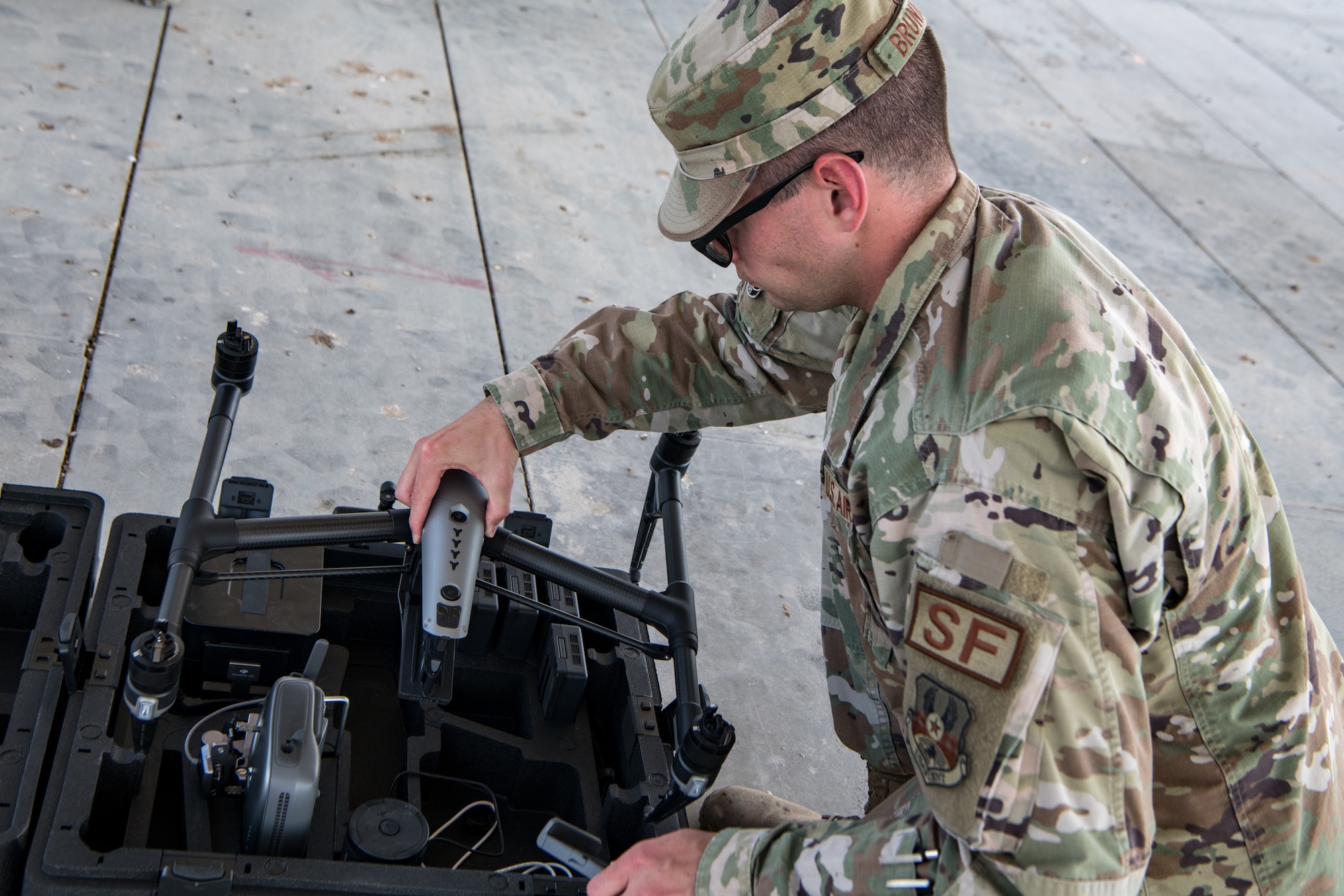 Airman puts drone into case