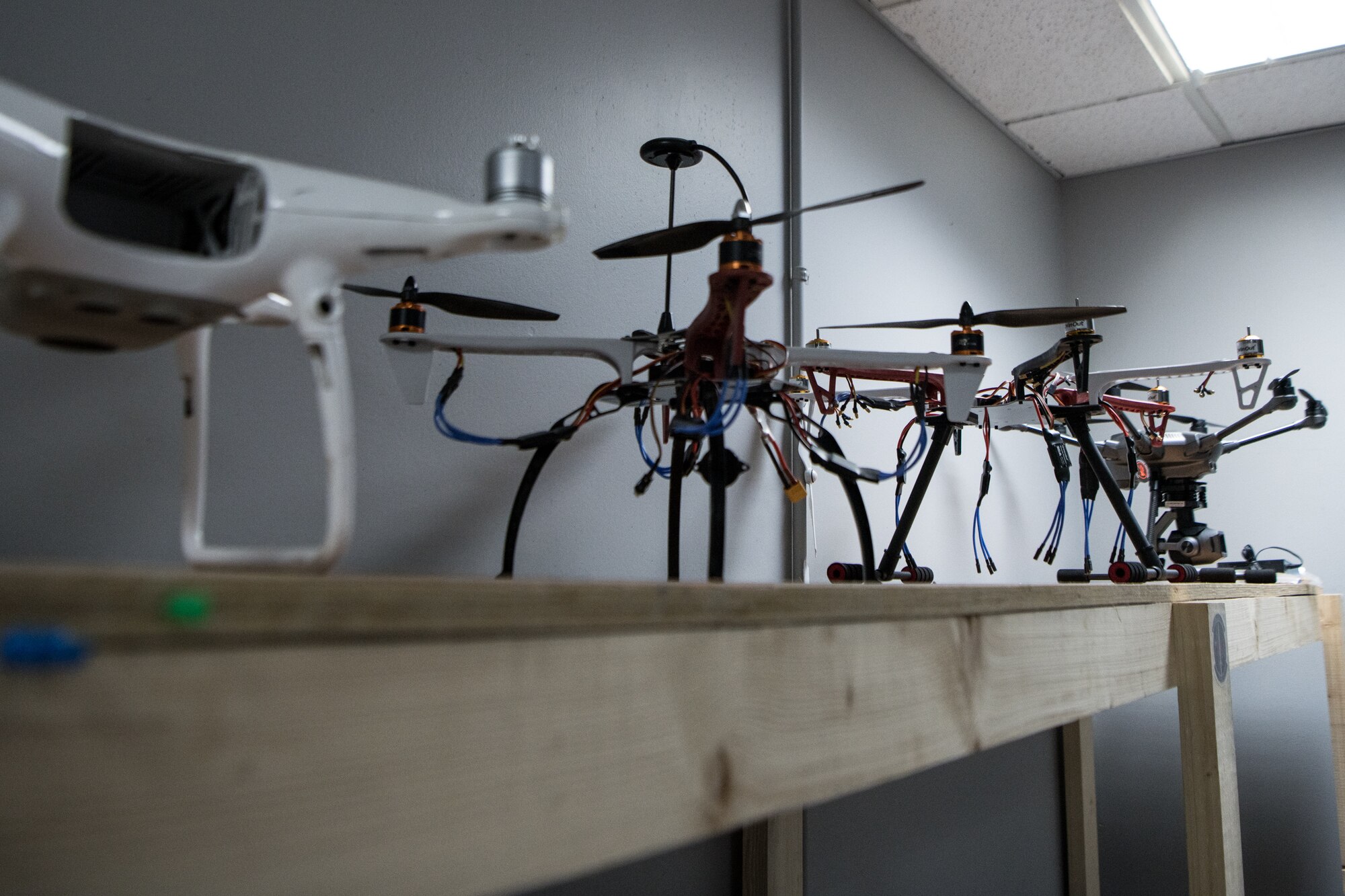 Drone models sit on shelf