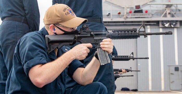 201106-N-NY362-1233 PHILIPPINE SEA (Nov. 6, 2020) Information Systems Technician 3rd Class Brice Harden, from Bryant, Ark., fires an M4 rifle during live-fire weapons training on the flight deck of the Ticonderoga-class guided-missile cruiser USS Shiloh (CG 67). Shiloh is forward-deployed to the U.S. 7th Fleet area of operations in support of security and stability in the Indo-Pacific region. (U.S. Navy photo by Mass Communication Specialist Seaman Santiago Navarro)