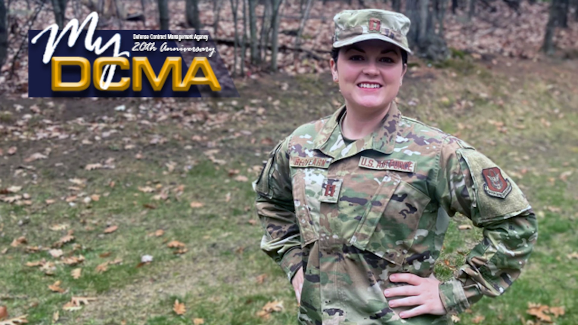Female Air Force officer wears her military uniform and cover while standing outside