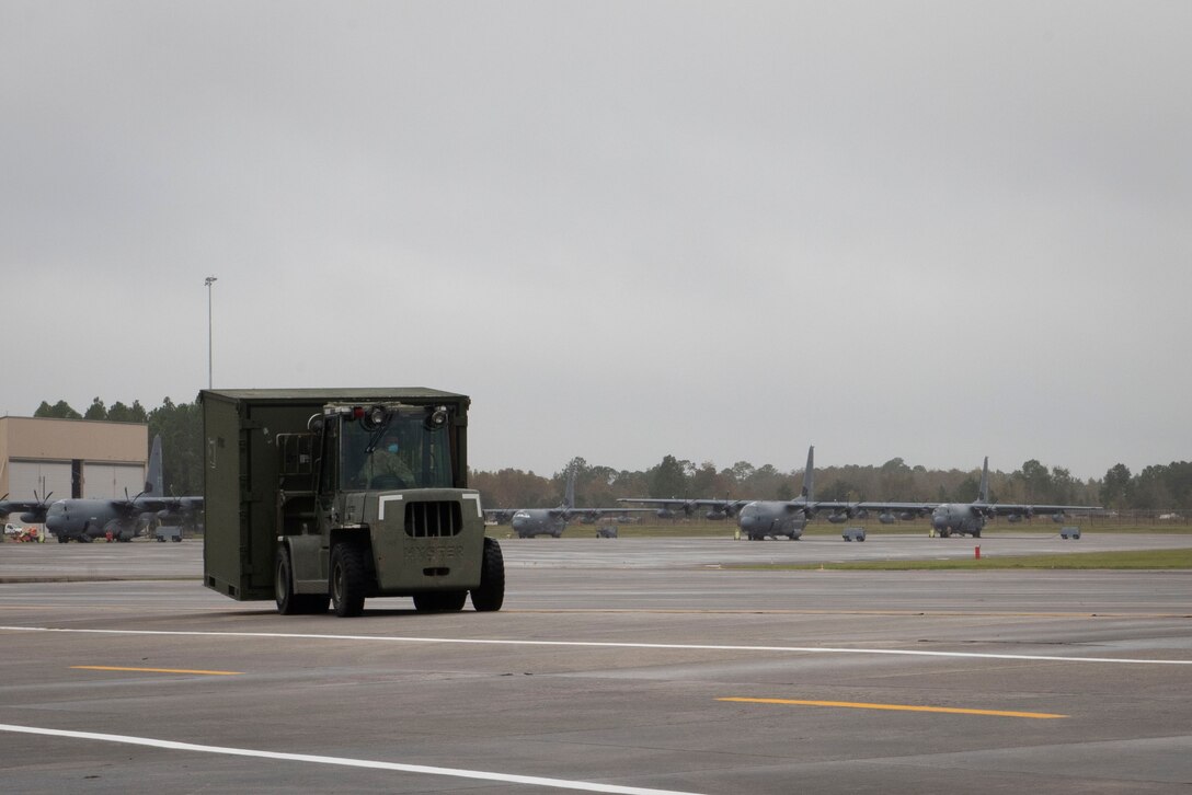 A photo of an Airman operating a forklift.