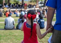 Members of the local community listen to guest speakers at the 8th annual Red, White and Blue Festival at the Hanahan Amphitheater, in Hanahan, S.C., November 7, 2020. Mayor Christie Rainwater, City of Hanahan mayor, and members of Joint Base Charleston and U.S. Marine Corps Recruiting Station Columbia also spoke about the importance of Veterans Day at the event. Additionally, the Joint Base Charleston Honor Guard presented the colors of each branch of service while the Charleston Southern University Concert Band played the official songs of the Army, Marine Corps, Navy, Air Force and Coast Guard.