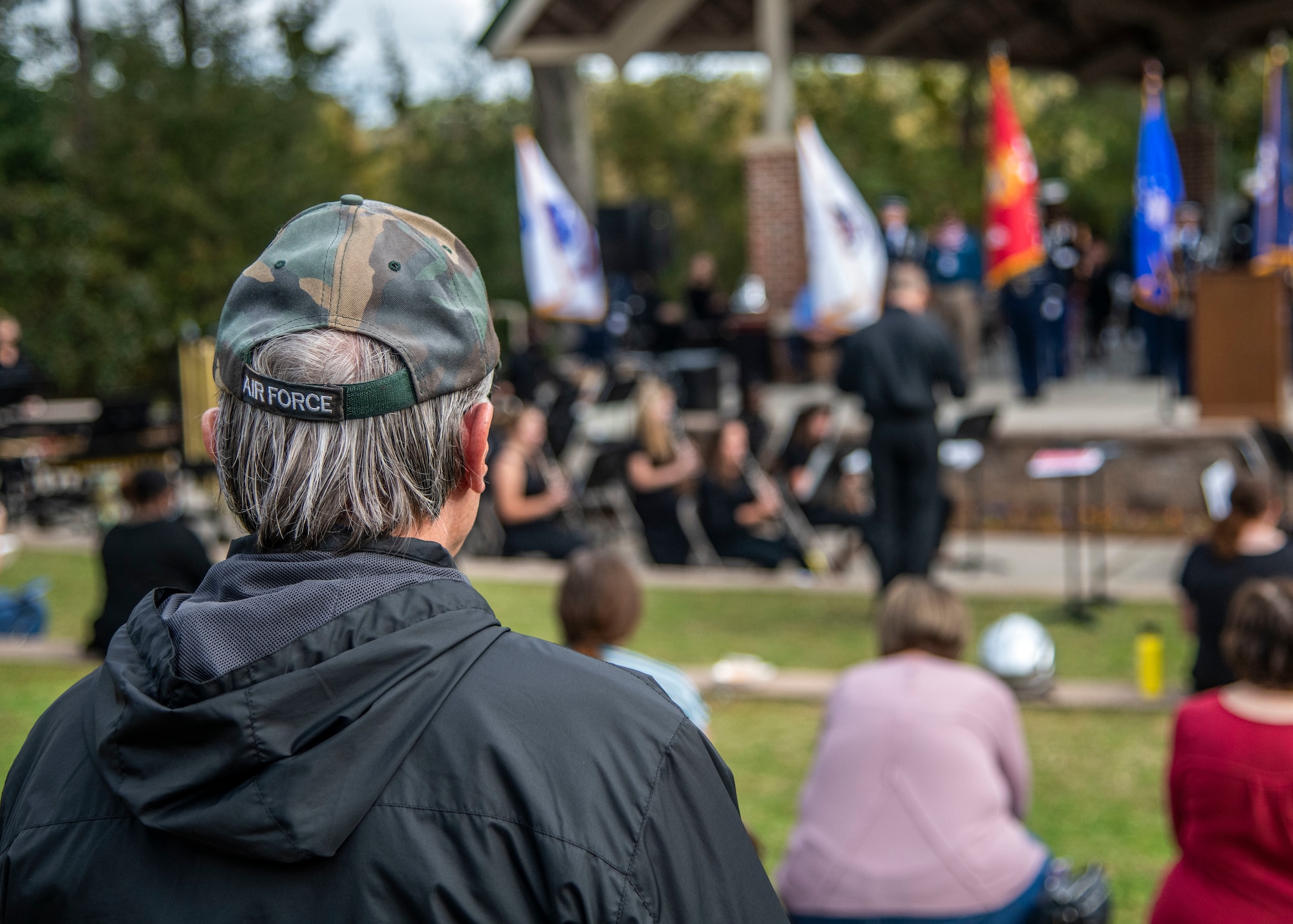 Members of the local community listen to guest speakers at the 8th annual Red, White and Blue Festival at the Hanahan Amphitheater, in Hanahan, S.C., November 7, 2020. Mayor Christie Rainwater, City of Hanahan mayor, and members of Joint Base Charleston and U.S. Marine Corps Recruiting Station Columbia also spoke about the importance of Veterans Day at the event. Additionally, the Joint Base Charleston Honor Guard presented the colors of each branch of service while the Charleston Southern University Concert Band played the official songs of the Army, Marine Corps, Navy, Air Force and Coast Guard.