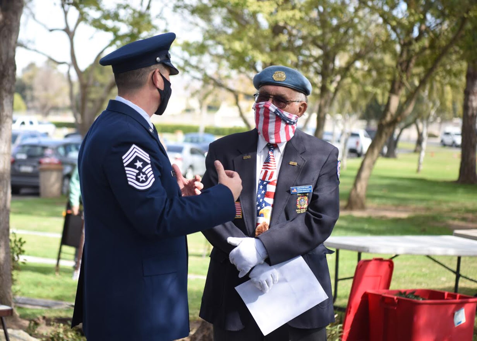 Chief Master Sgt. Jason Delucy, 30th Space Wing command chief, interacts with event organizers during a Veterans Day ceremony Nov. 11, 2020, in Santa Maria, Calif. Congress passed a resolution in 1926 for an annual observance to be celebrated for Veterans Day, and November 11th became a national holiday in 1938. Veterans Day pays tribute to all American veterans, past and present. (U.S. Space Force photo by Senior Airman Hanah Abercrombie)