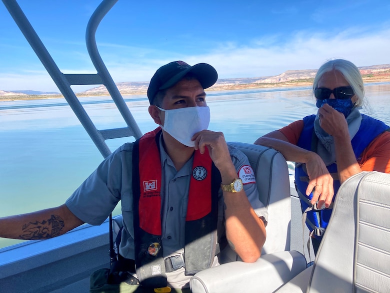 Abiquiu Lake park ranger Nathaniel Naranjo and Tori White, USACE-South Pacific Division chief of Operations and Regulatory, take a boat to reach the shoreline where they picked up trash during Abiquiu Lake’s NPLD event, Sept. 26, 2020.