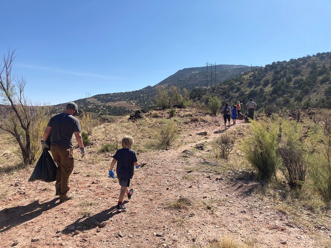 Albuquerque District commander Lt. Col. Patrick Stevens and his family join Tori White, South Pacific Division chief of Operations and Regulatory, and Abiquiu Lake park ranger Nathaniel Naranjo in picking up trash at Abiquiu Lake, Sept. 26, 2020.