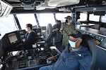 Crew members aboard USNS Millinocket (T-EPF 3) navigate the ship from the bridge as ships from the Bangladesh Navy maneuver in formation during the sea phase of Cooperation Afloat Readiness and Training (CARAT) Bangladesh. This year marks the 26th iteration of CARAT, a multinational exercise designed to enhance U.S. and partner navies' abilities to operate together in response to traditional and non-traditional maritime security challenges in the Indo-Pacific region.