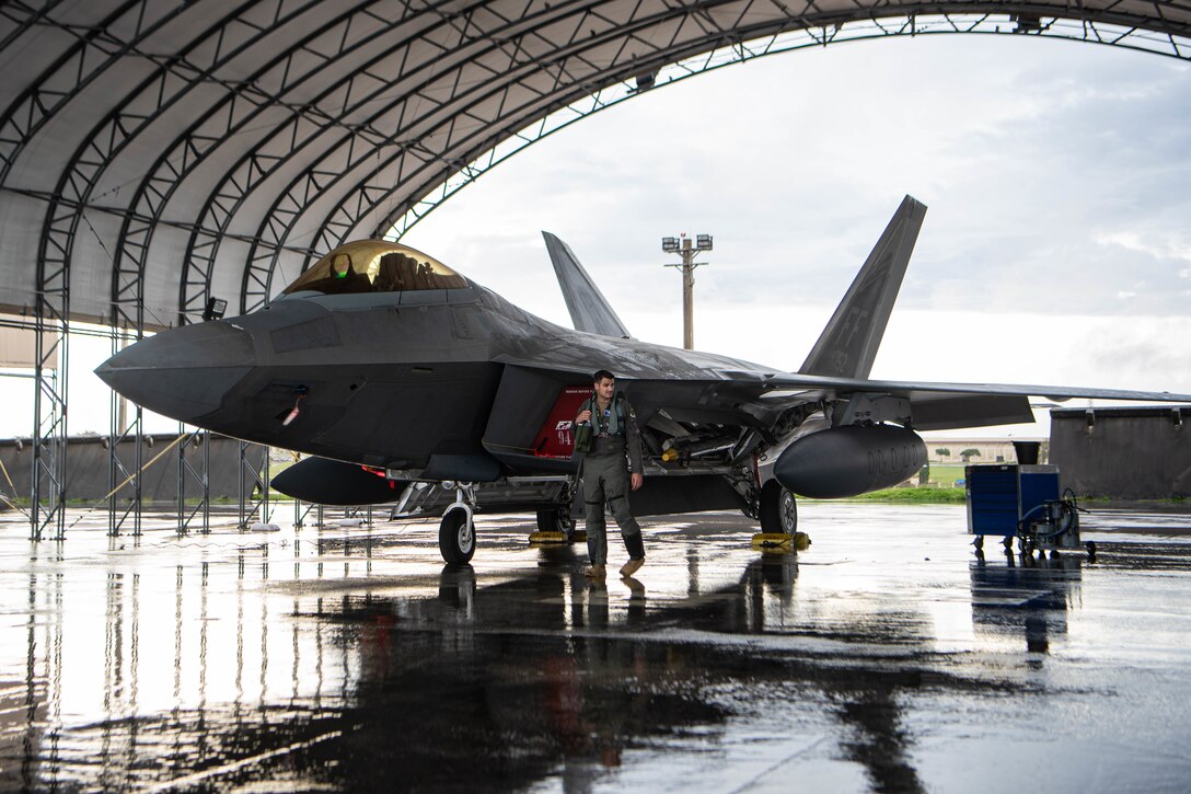 A team of F-22 Raptors, with the 94th Fighter Squadron at Joint Base Langley-Eustis, Virginia, prepare for a Veterans Day flyover out of Andersen Air Force Base, Guam on November 11, 2020. The fighters commemorated Veterans Day by flying over Palau, Saipan, and Guam. (U.S. Air Force photo by Senior Airman Katelin Britton)