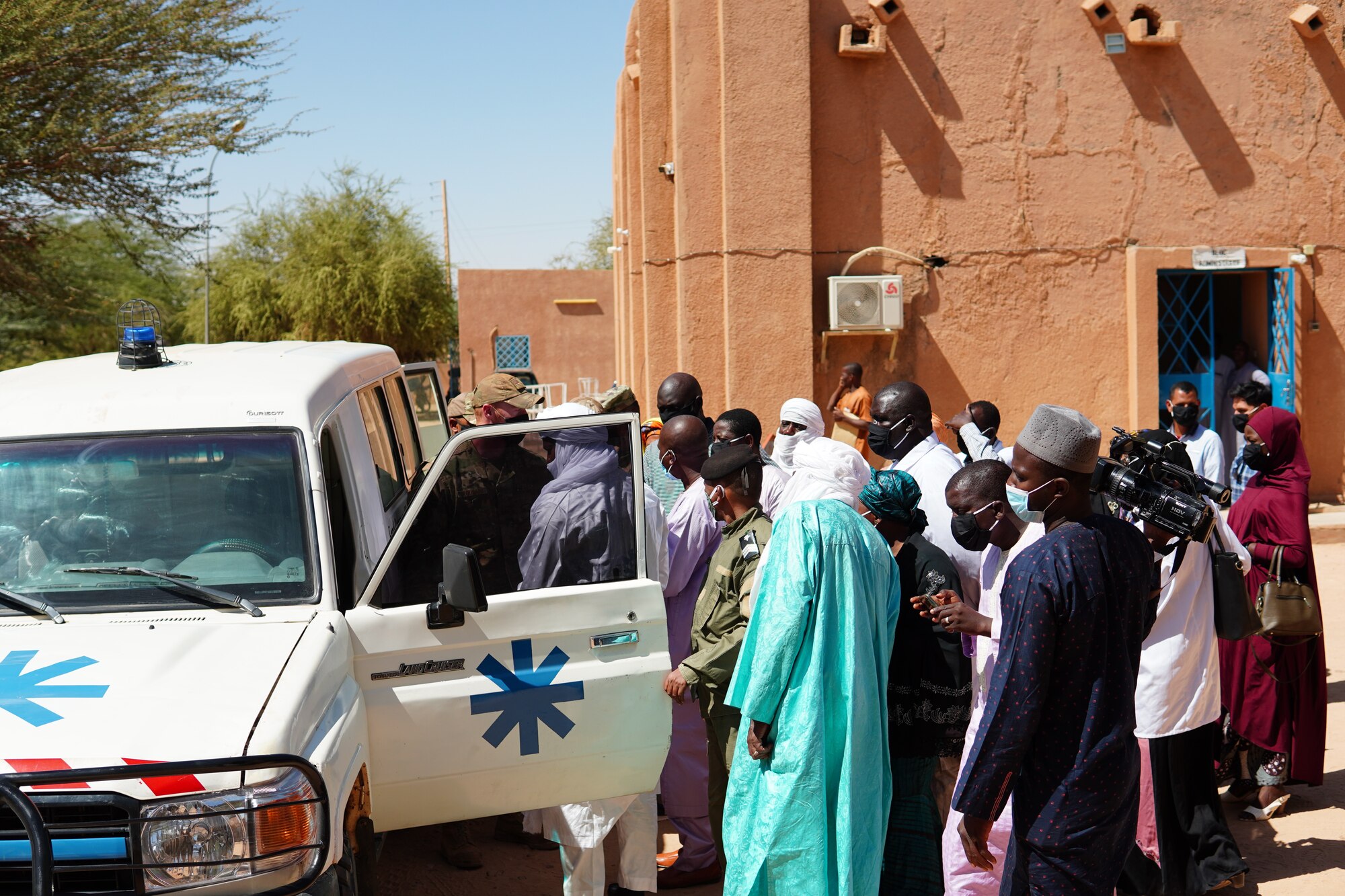 U.S. Air Force Staff Sgt. Jeffrey Urquhart, 724th Logistics Readiness Flight vehicle maintenance technician, gives medial staff and media an overview of the newly restored ambulance at the District Sanitaire Commune d'Agadez clinic in Agadez, Niger, Oct. 30, 2020. In addition to the necessary repairs, the ambulance also received medical equipment which was previously non-existent.