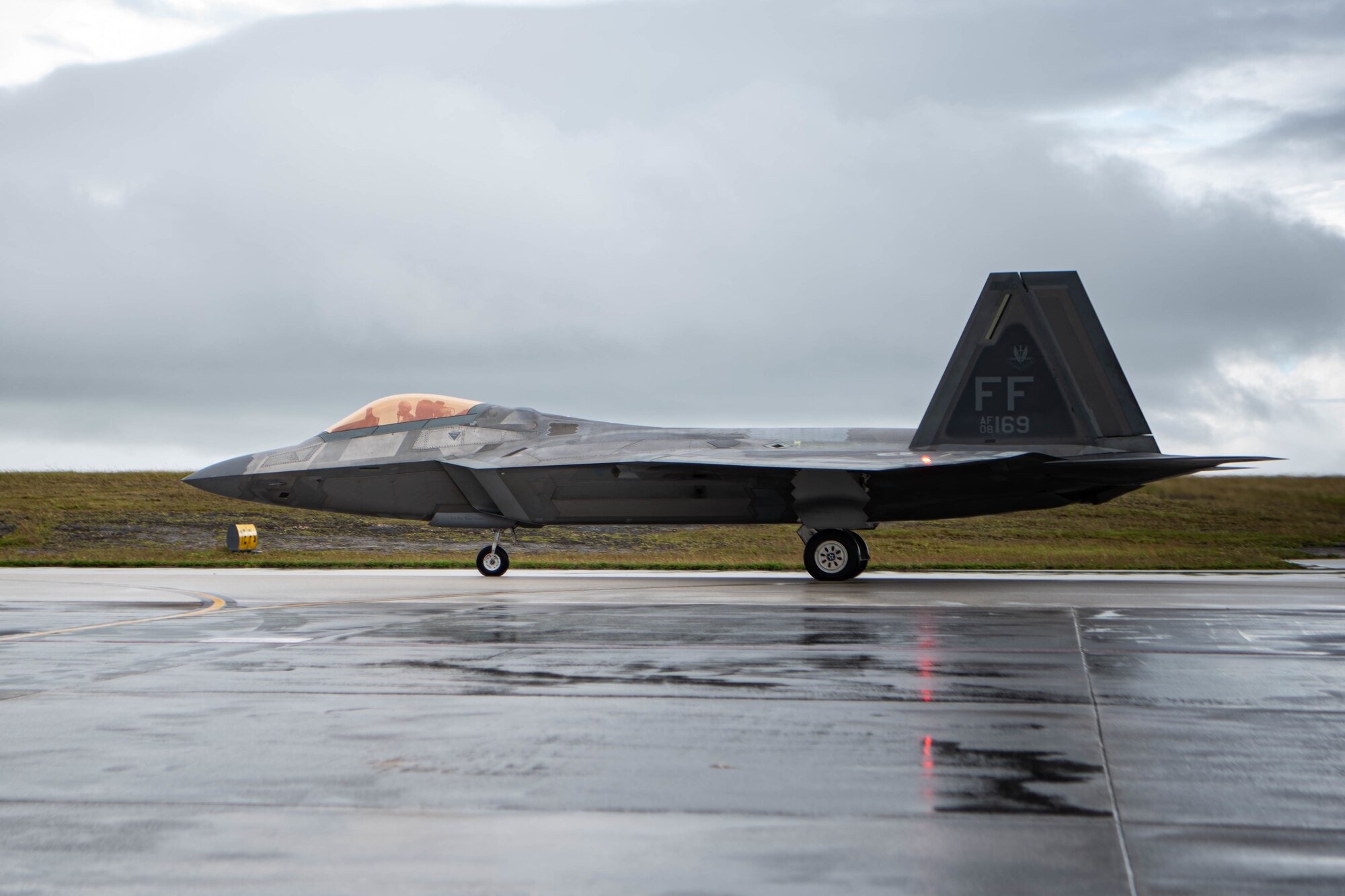 A team of F-22 Raptors, with the 94th Fighter Squadron at Joint Base Langley-Eustis, Virginia, prepare for a Veterans Day flyover out of Andersen Air Force Base, Guam on November 11, 2020. The fighters commemorated Veterans Day by flying over Palau, Saipan, and Guam. (U.S. Air Force photo by SrA Katelin Britton)