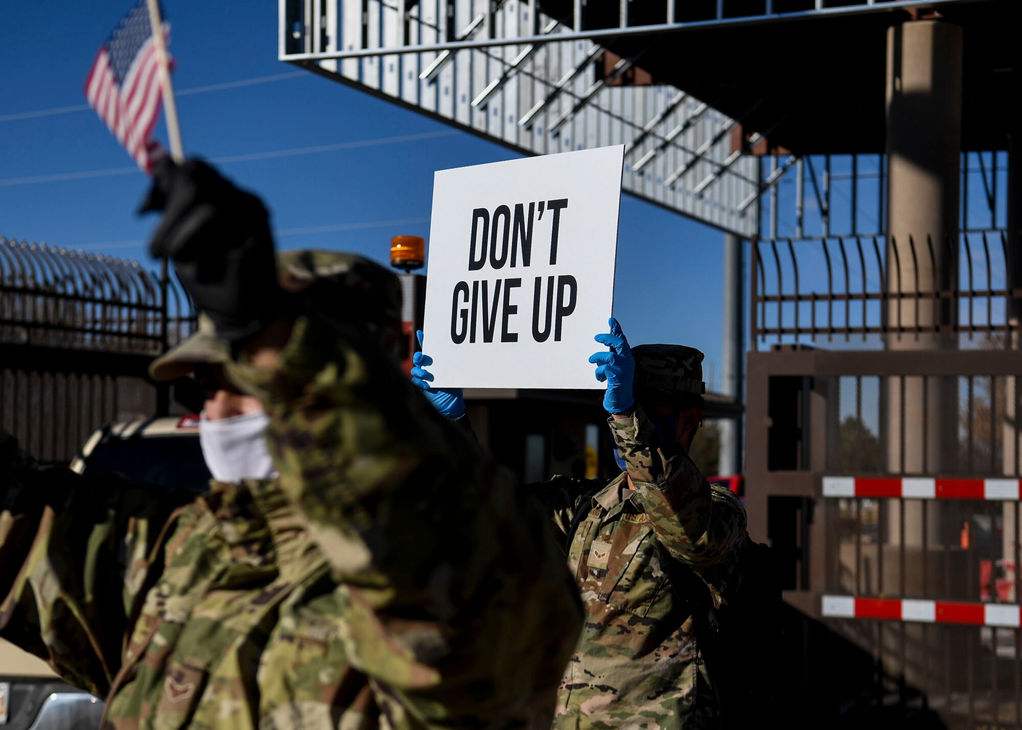 Airman hold up signs of support.