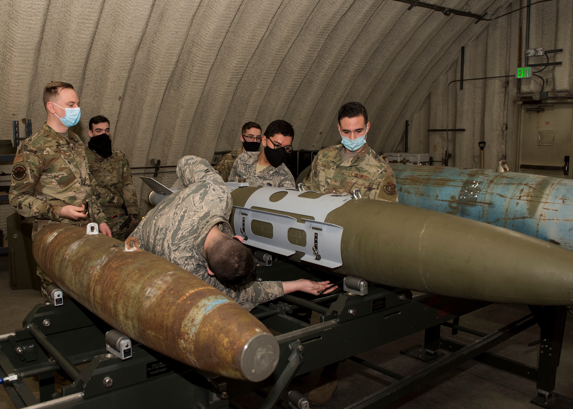 U.S. Air Force Staff Sgt. Jacob Smith, the 3rd Munitions Squadron training supervisor, teaches a combat munitions training class at Joint Base Elmendorf-Richardson, Alaska, Nov. 5, 2020. U.S. Air Force Tech. Sgt. Nicholas Kern, the 3rd MUNS training section chief, revamped his squadron’s training section and implemented an expanded CMT program that familiarizes ammo troops with a variety of munitions in one location.