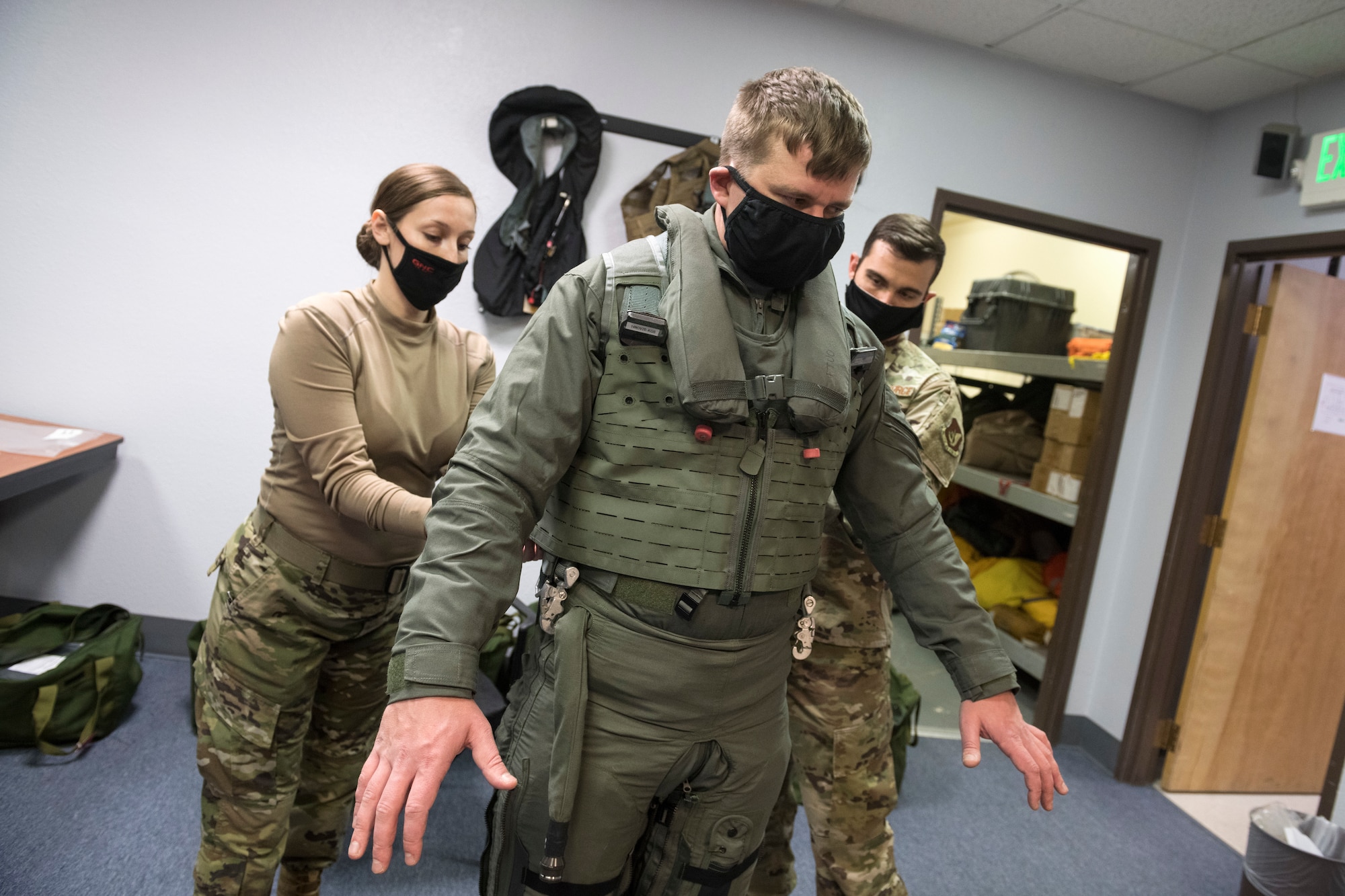 U.S. Air Force Capt. Jon “Dexter” Keranen, a F-22 pilot assigned to the 3rd Operations Support Squadron, is outfitted by air flight equipment technicians with a newly received state-of-the-art integrated aircrew ensemble (IAE) flight suit and gear at Joint Base Elmendorf-Richardson, Alaska, Nov. 9, 2020. The brand-new, custom-fit gear mitigates adverse physiological effects on F-22 Raptor pilots by reducing the thermal burden while increasing mobility and comfort. (U.S. Air Force photo by Alejandro Peña)