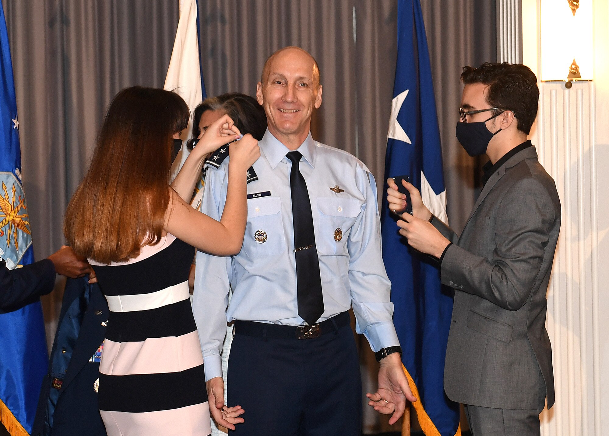 Gen. David Allvin's family places his new rank on his uniform during his promotion ceremony at Joint Base Anacostia-Bolling, Washington, D.C., Nov. 12, 2020. Allvin will serve as the 40th Vice Chief of Staff of the Air Force. (U.S. Air Force Photo by Andy Morataya)