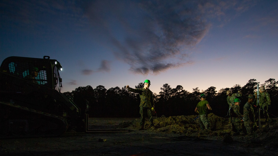 Marines and Sailors prepare to fill a crater during a base repair after attack training (BRAAT) event at Marine Corps Outlying Field Oak Grove, North Carolina.