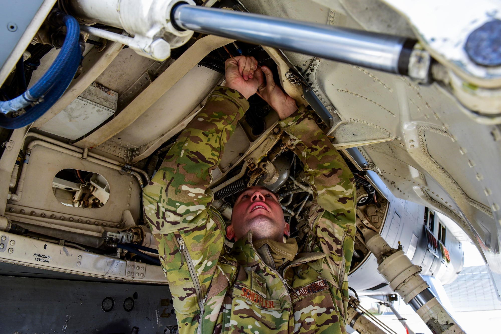 An Airman tightens a bolt.