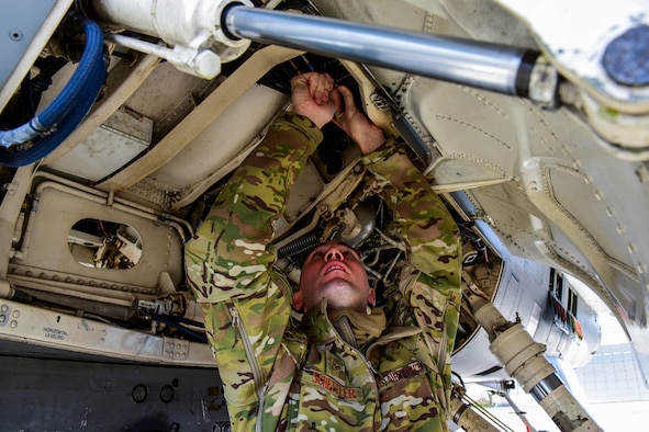 An Airman tightens a bolt.