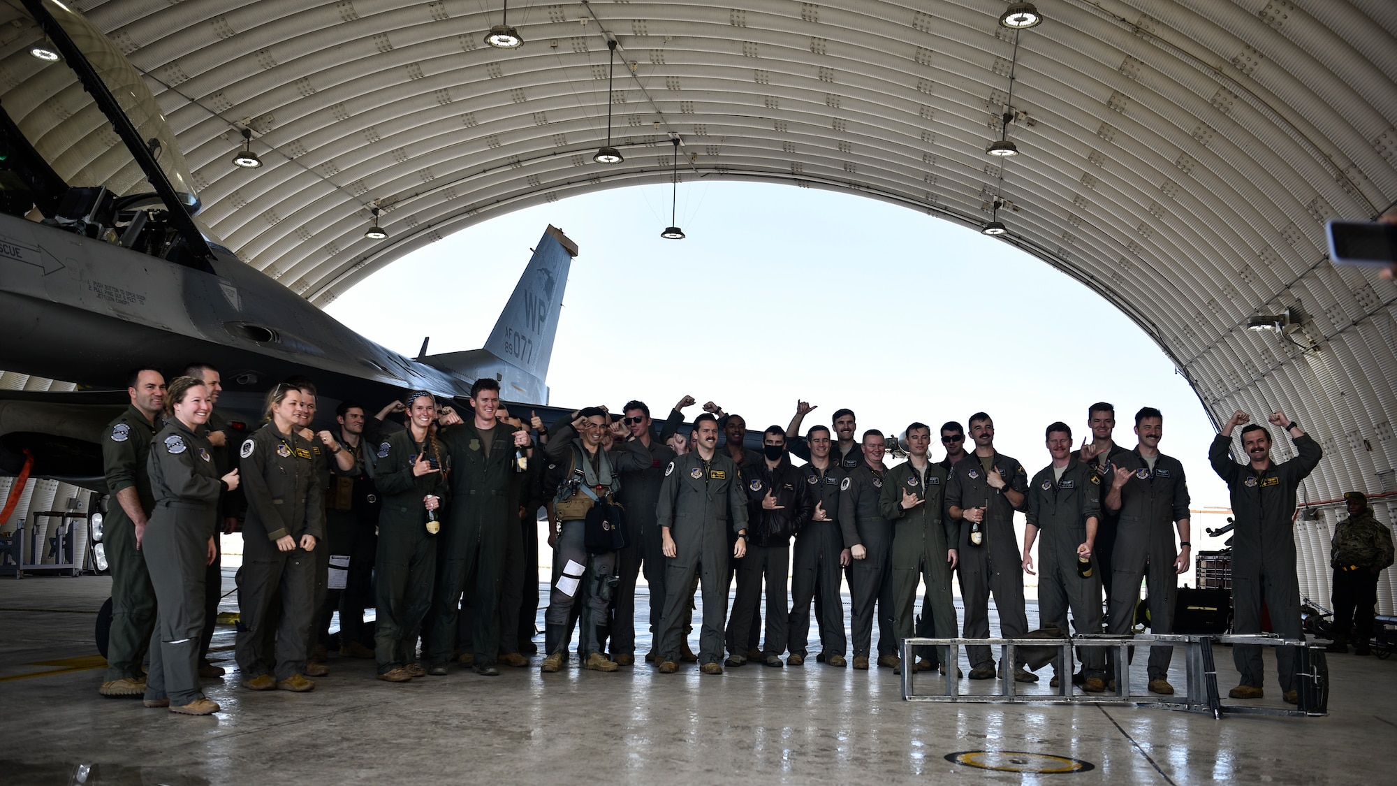 A group of pilots pose for a photo.