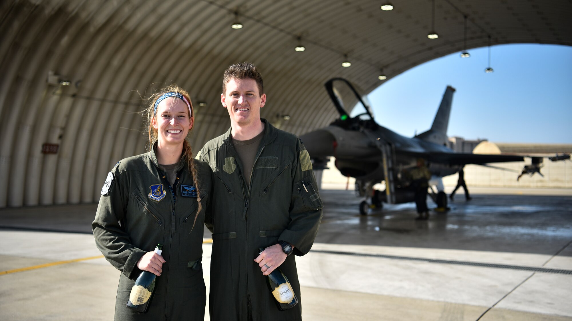 Married pilots pose for a photo together.