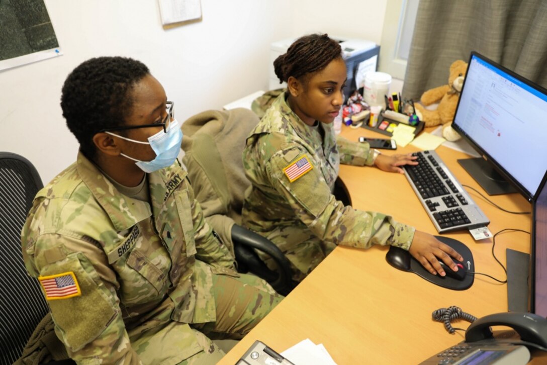 MIHAIL KOGALNICEANU, ROMANIA -- Staff Sgt. Breanna Gray, Non-Commissioned Officer in Charge, Troop Medical Clinic, and one of her Soldiers, Spc. Laneeja Sheppard, Senior Medic, MK Aid Station, review a daily task report to plan for what needs to be accomplished. “She's always squared away. She doesn't forget my tasks or her tasks and we both have a million things to do. Even while she is doing her job, she reminds me, make sure you check on this, make sure you do that,” said Sheppard. “You can ask Staff Sgt. Gray to do anything and she can get it done.” (U.S. Army photo by Sgt. H. Marcus McGill)