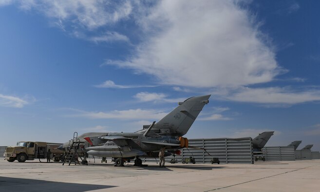 U.S. Air Force Staff Sgt. Thomas Monte, 407th Expeditionary Support Squadron Morale, Welfare and Recreation facility non-commissioned officer in charge, grabs a bag of popcorn at Ahmed Al Jaber Air Base, Kuwait, Nov. 6, 2020.