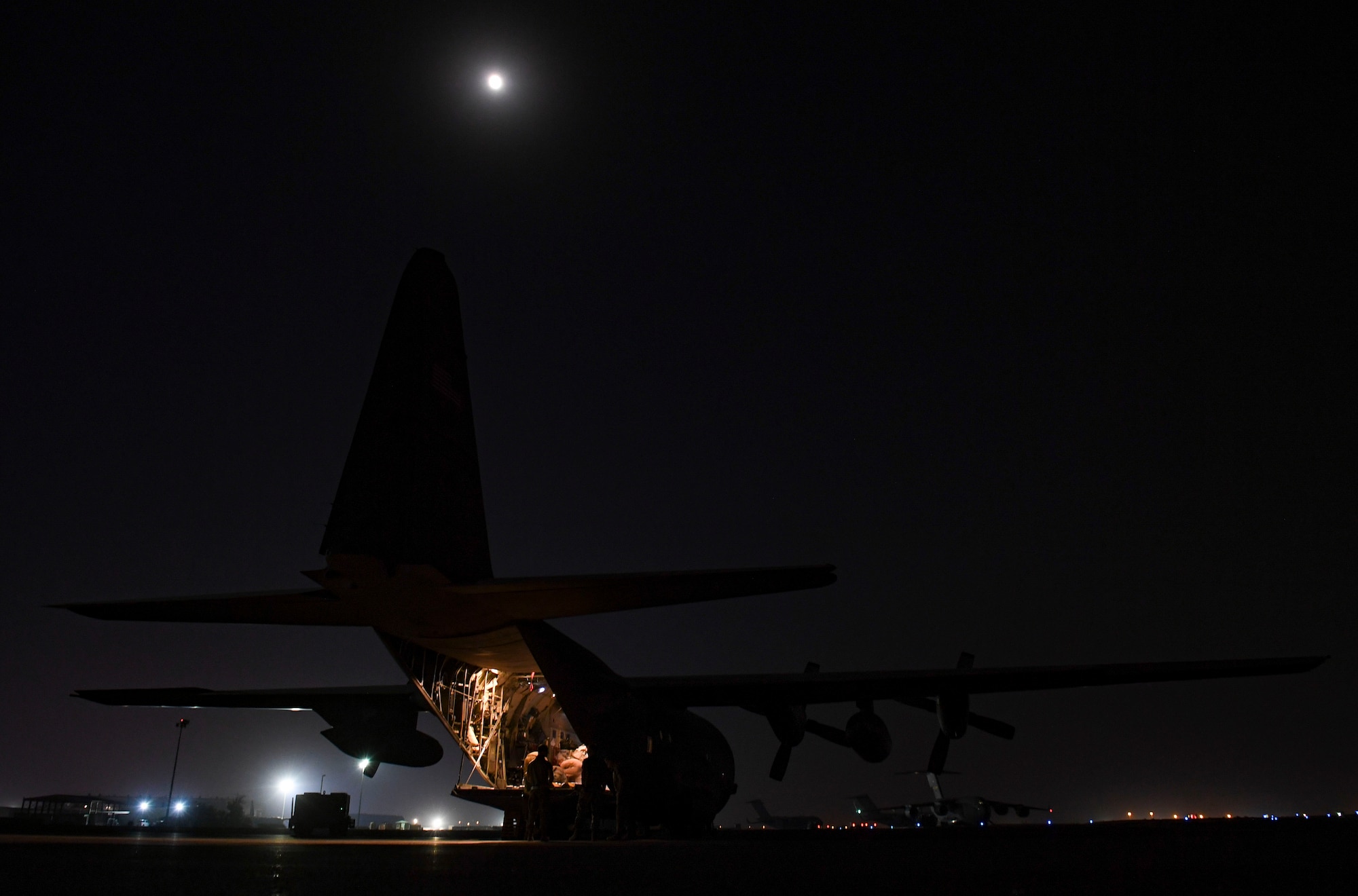 U.S. Air Force Airmen prepare to load cargo onto a C-130 Hercules at Ali Al Salem Air Base, Kuwait Oct. 30, 2020.