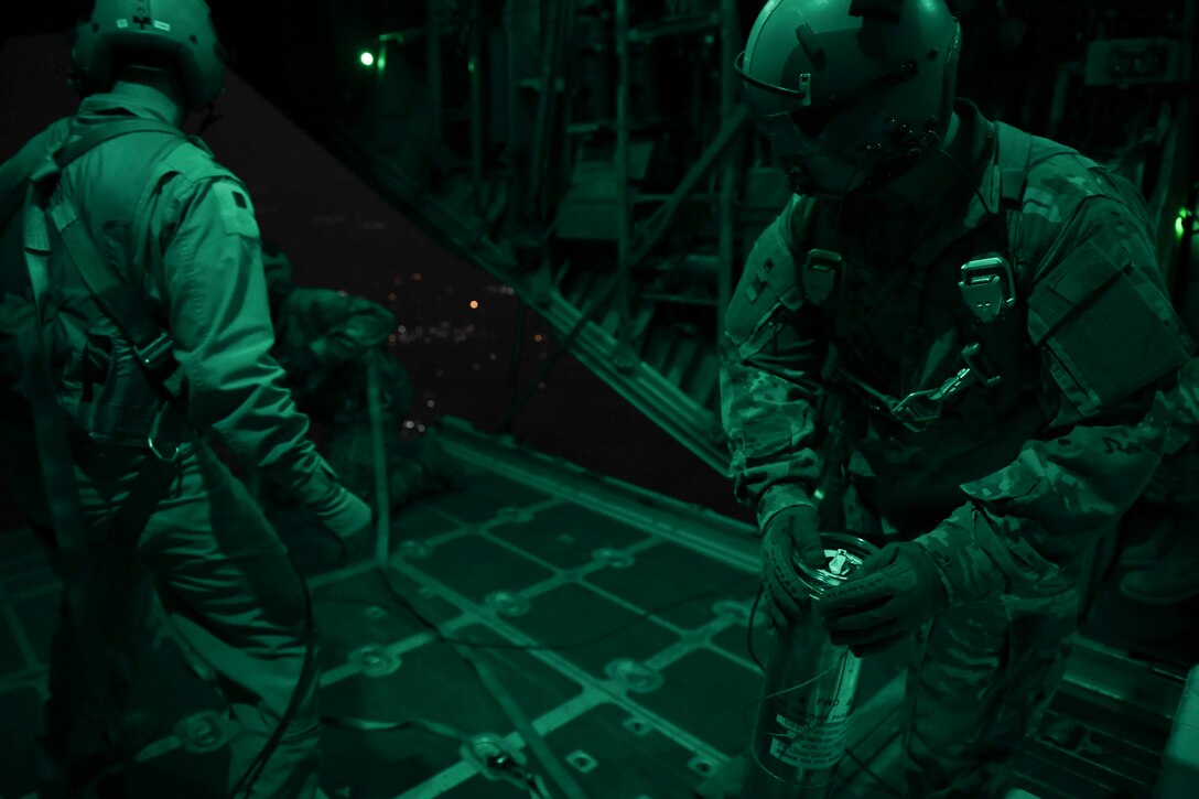 U.S. Air Force Airmen prepare to drop illumination flares from a C-130 Hercules Oct. 30, 2020.