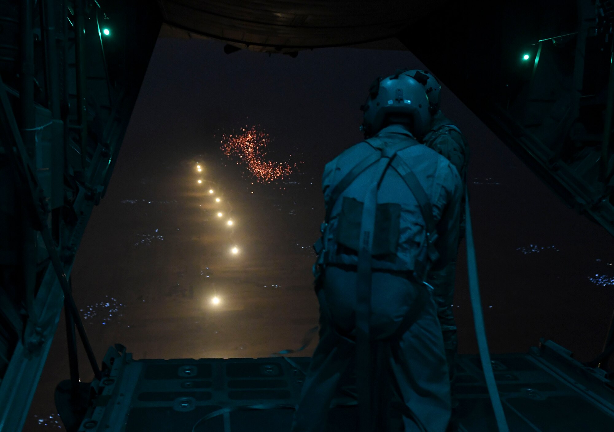 U.S. Air Force Airmen prepare to drop illumination flares from a C-130 Hercules Oct. 30, 2020.