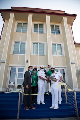 201112-N-OU681-1037 CORPUS CHRISTI, Texas (Nov. 12, 2020) Chief of Naval Air Training (CNATRA) Rear Adm. Robert Westendorff, center, Naval Air Station Corpus Christi Commanding Officer Capt. Chris Jason, right, along with distinguished guests perform a ceremonial ribbon-cutting ceremony for the newly renovated CNATRA headquarters building on base Nov. 12, 2020. CNATRA trains the world's finest Naval Aviation professionals delivering them to the Navy, Marine Corps, and Coast Guard. (U.S. Navy photo by Lt. Michelle Tucker/Released)