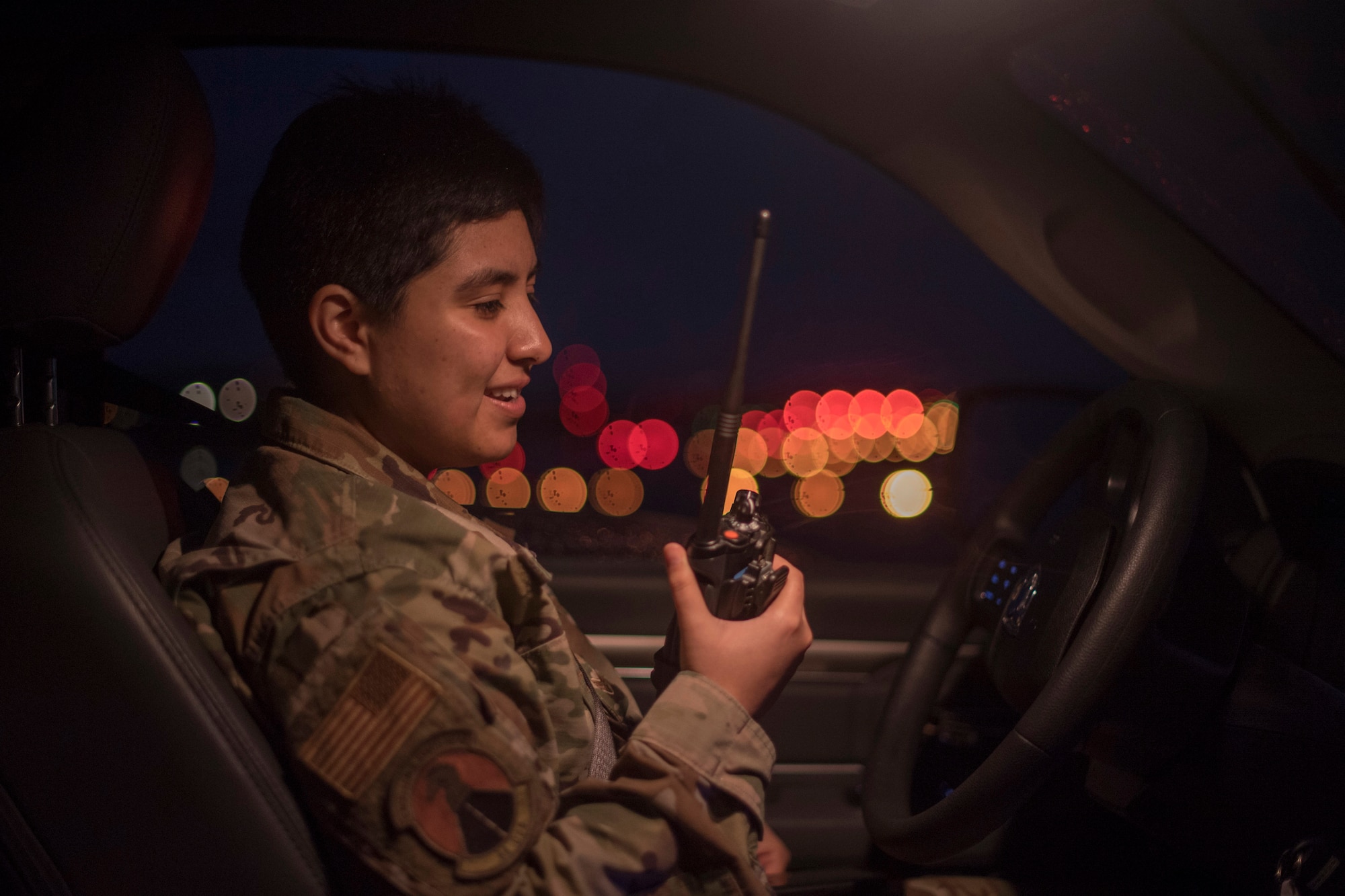 An Airman holding a radio.