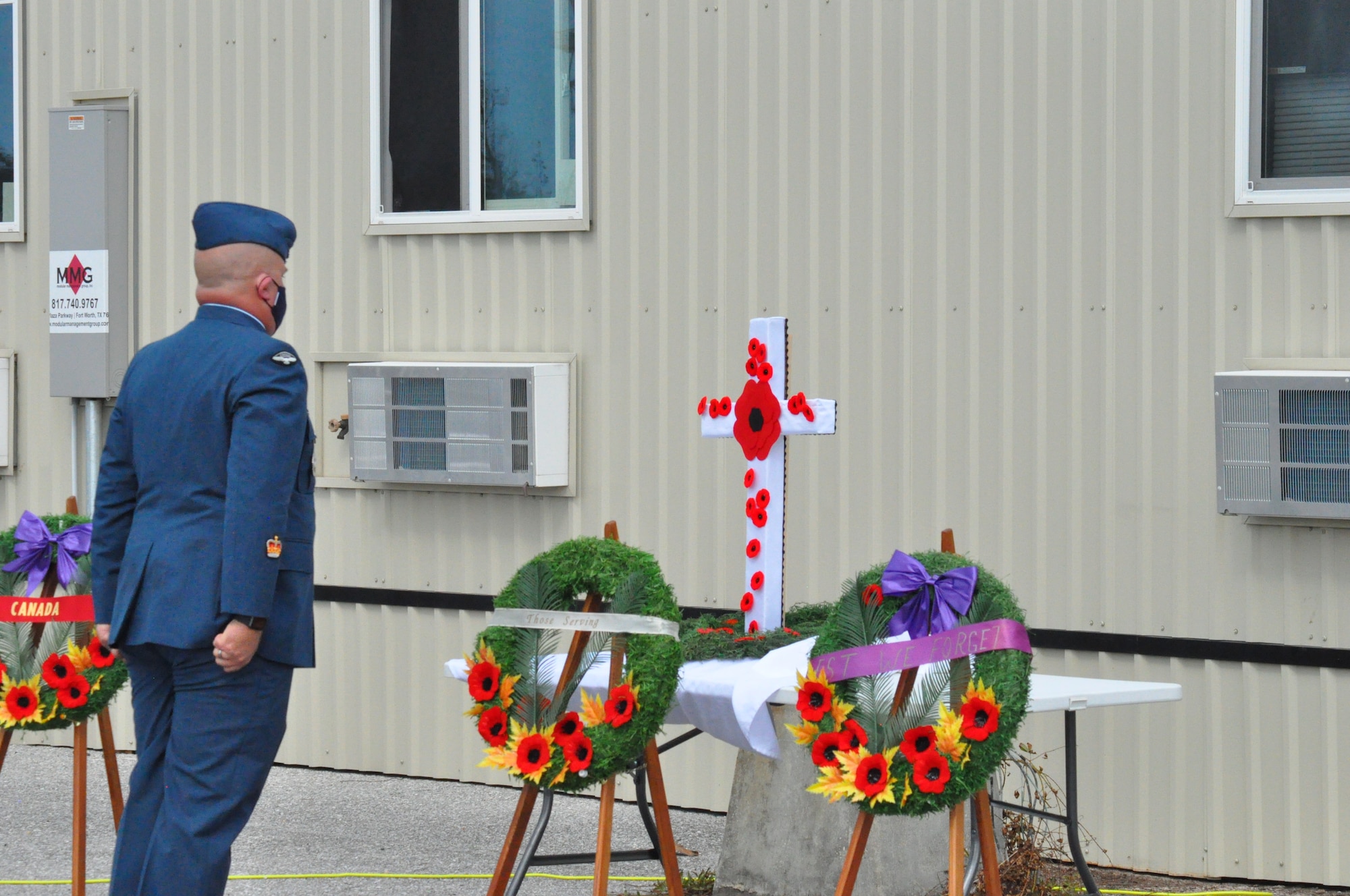 Warrant Officer Donnie Smith, at attention in front of the Cenotaph, paying his respects