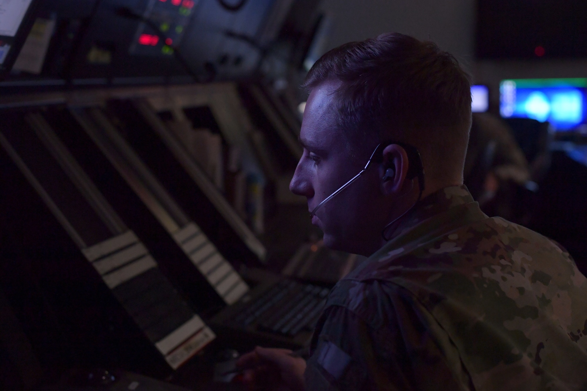 An Airman wearing a headset.