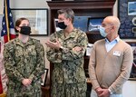 Adm. Robert P. Burke, commander, U.S. Naval Forces Europe-Africa and Fleet Master Chief Derrick A. Walters recognize  work performance and Signature Behaviors during a virtual “Bravo Strike”