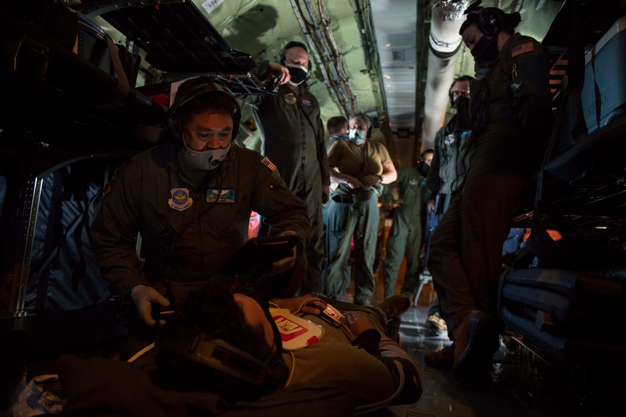 Wyoming Air National Guard 1st Lt. Chris Hendricks, 187th Aeromedical Evacuation Squadron flight nurse, performs aeromedical evacuation training prior to an AE mission en route to Japan, Nov. 10, 2020. Aeromedical evacuation is one the most important and challenging missions for aircrew, and can take place at anytime, anywhere (U.S. Air Force photo by Senior Airman Lawrence Sena)