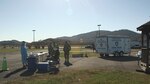 Members of the West Virginia National Guard's COVID-19 response prepare for a COVID-19 testing lane Nov. 7, 2020. Since Oct. 30, 2020, West Virginia National Guard personnel, with the assistance of local health department workers, have been working around the clock the establish locations, advertise testing and conduct nearly 400 testing lanes throughout West Virginia. (U.S. Army National Guard photo by Sgt. Davis Rohrer)