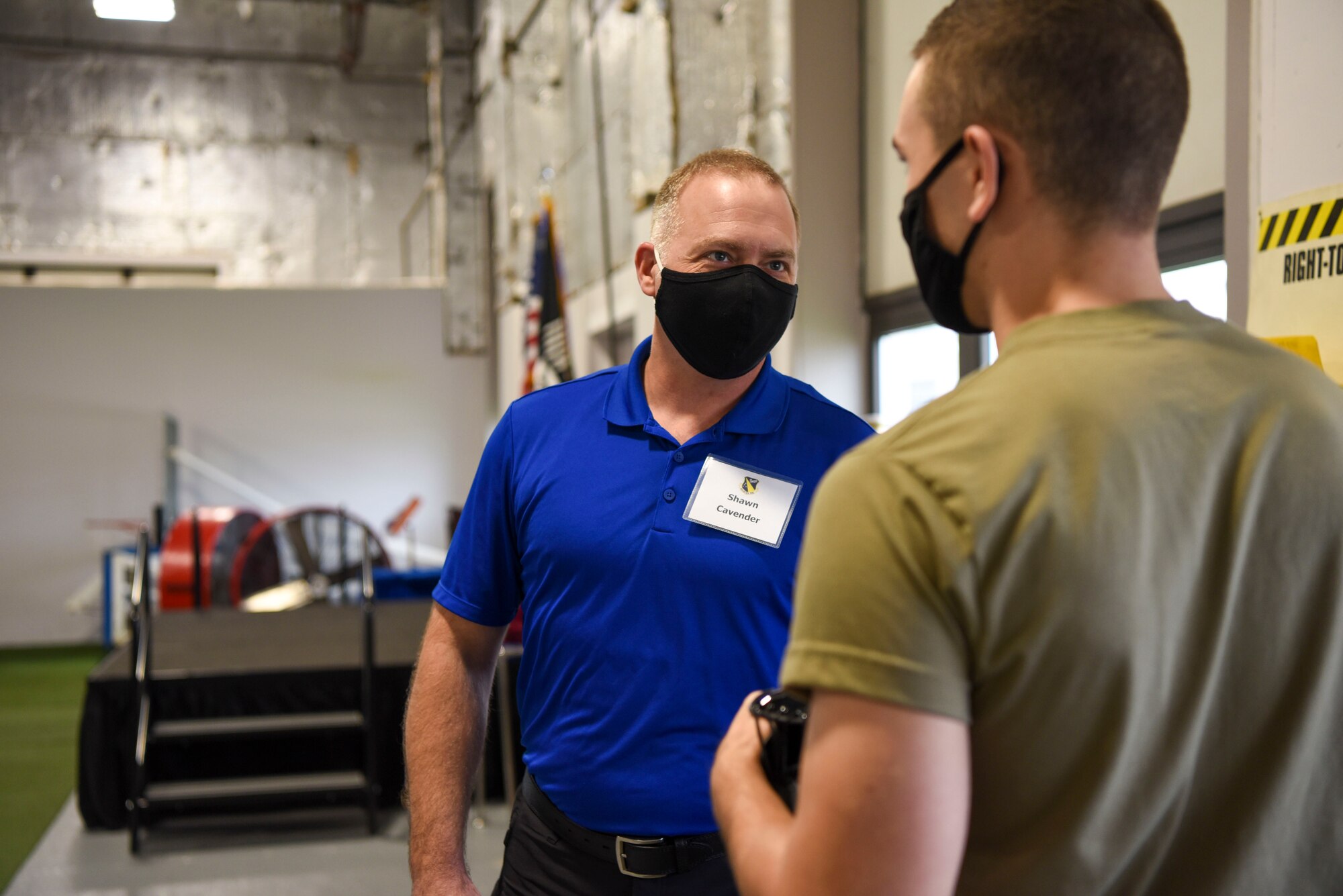 Senior leader spouses from the 88th Air Base Wing hand out candy to Honor Guard Airmen during their Oct. 30 tour of Wright-Patterson Air Force Base. This was among many stops for the spouses as they got a look at the people, workspaces and missions of WPAFB.