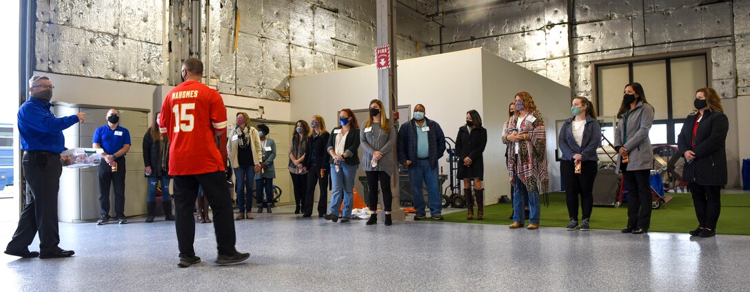 The 88th Air Base Wing Senior Leader Spouse's stop by the Honor Guard building during their base tour to hand out candy to the Honor Guard Airmen on Wright-Patterson Air Force Base, Ohio, Oct. 30, 2020. This was one of the many stops for the spouse’s on the tour to familiarize themselves with the diverse people, workspaces and missions of WPAFB.