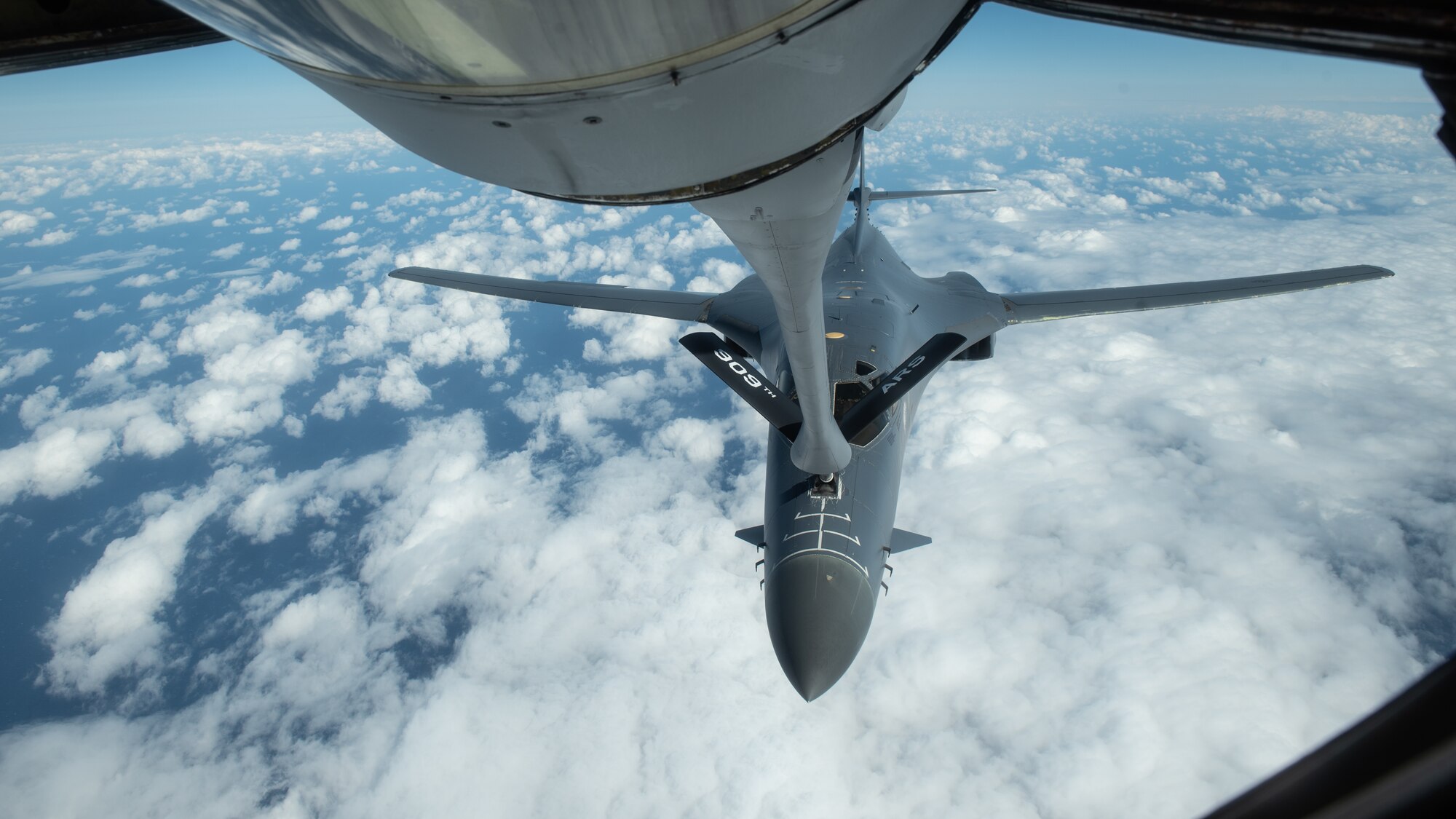 A U.S. Air Force B-1B Lancer receives fuel from a 909th Aerial Refueling Squadron KC-135 Stratotanker during a Bomber Task Force mission, Nov. 13, 2020, over the Pacific Ocean. The B1-B Lancers are deployed as a Bomber Task Force which enables Airmen to continuously conduct operations throughout the world, maintain global stability and security, and familiarize units with joint and bilateral operations in different regions. (U.S. Air Force photo by Staff Sgt. Peter Reft)