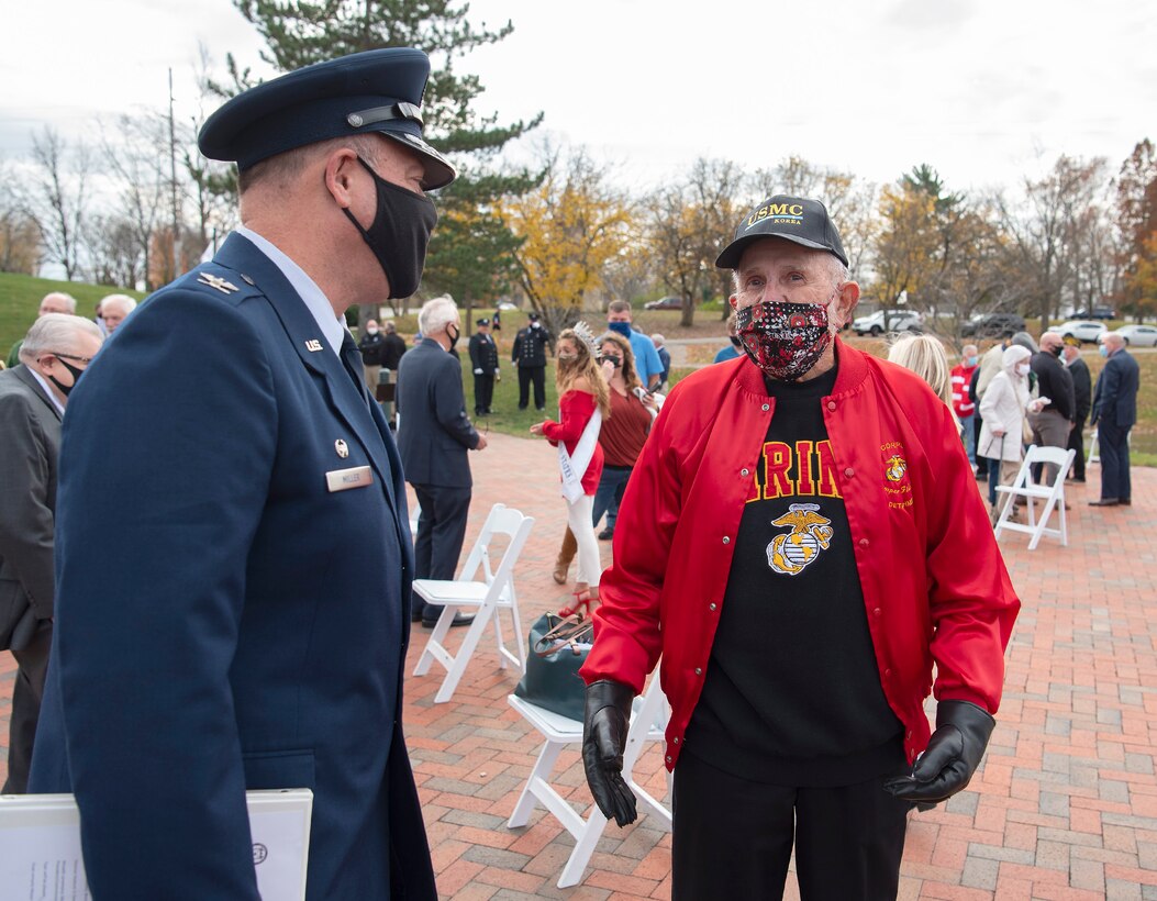 Air Force Col. Patrick Miller, 88th Air Base Wing and Wright-Patterson Air Force Base installation commander, visits with John Corbet, a U.S. Marine veteran who saw combat during the Korean War, following the Centerville, Ohio, Veterans Day observance Nov. 11, 2020. Corbet is a Centerville resident and attended the event where Miller was the feature speaker.