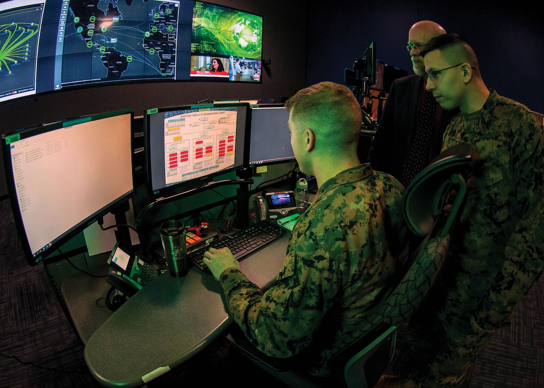 Marines with Marine Corps Forces Cyberspace Command in operations center at Lasswell Hall aboard Fort Meade, Maryland