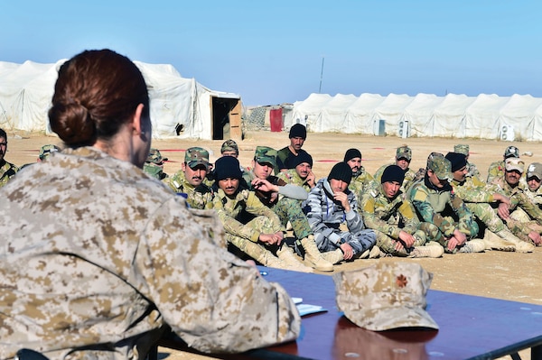 Judge advocate from Naval Special Warfare Command, assigned as Legal Special Projects Officer for special operations command under Combined Joint Task Force–Operation Inherent Resolve, conducts special Law of Armed Conflict and rules of engagement training for first graduating company of unique, multitribe Iraqi force, the A’ali Al Furat Brigade, at training ground in Western Iraq, January 4, 2017 (U.S. Navy/John Fischer)