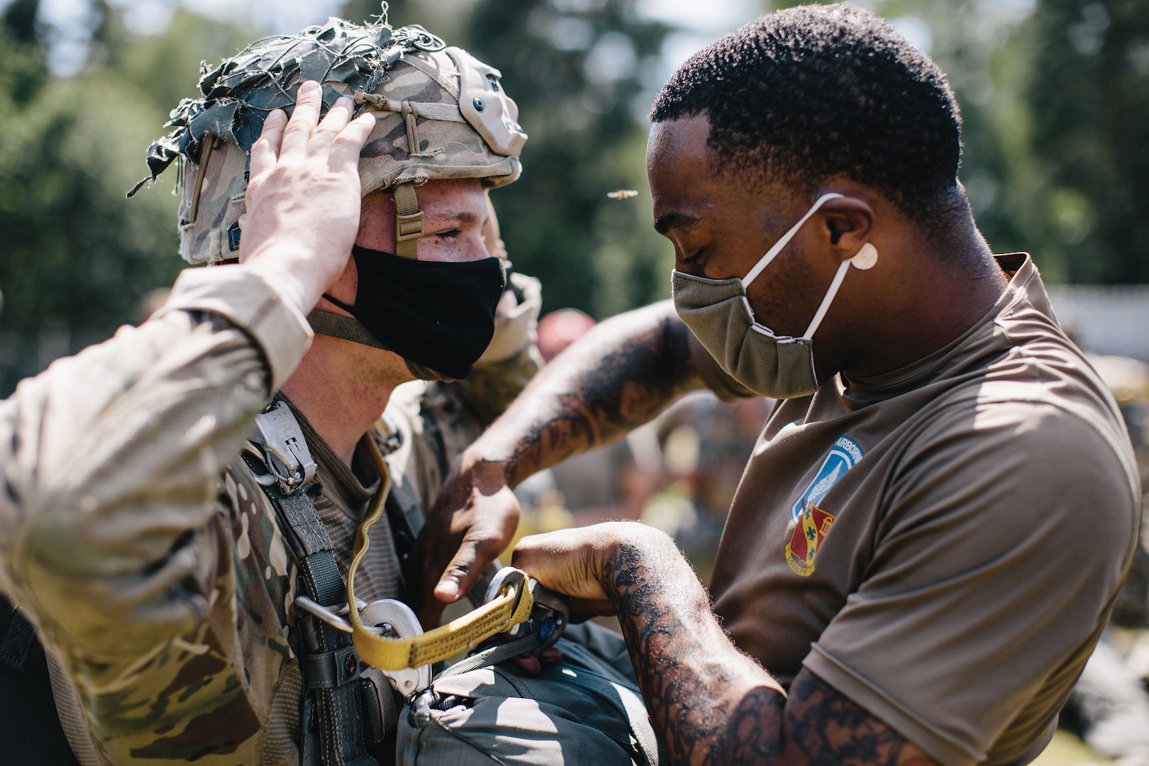 Paratroopers assigned to 173rd Airborne Brigade conduct inspections prior to airborne operations