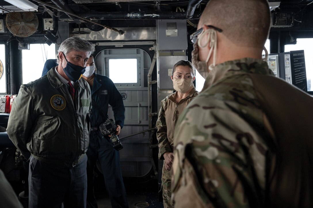 Members of USS Normandy visit, board, search, and seizure team brief Navy Secretary Kenneth Braithwaite